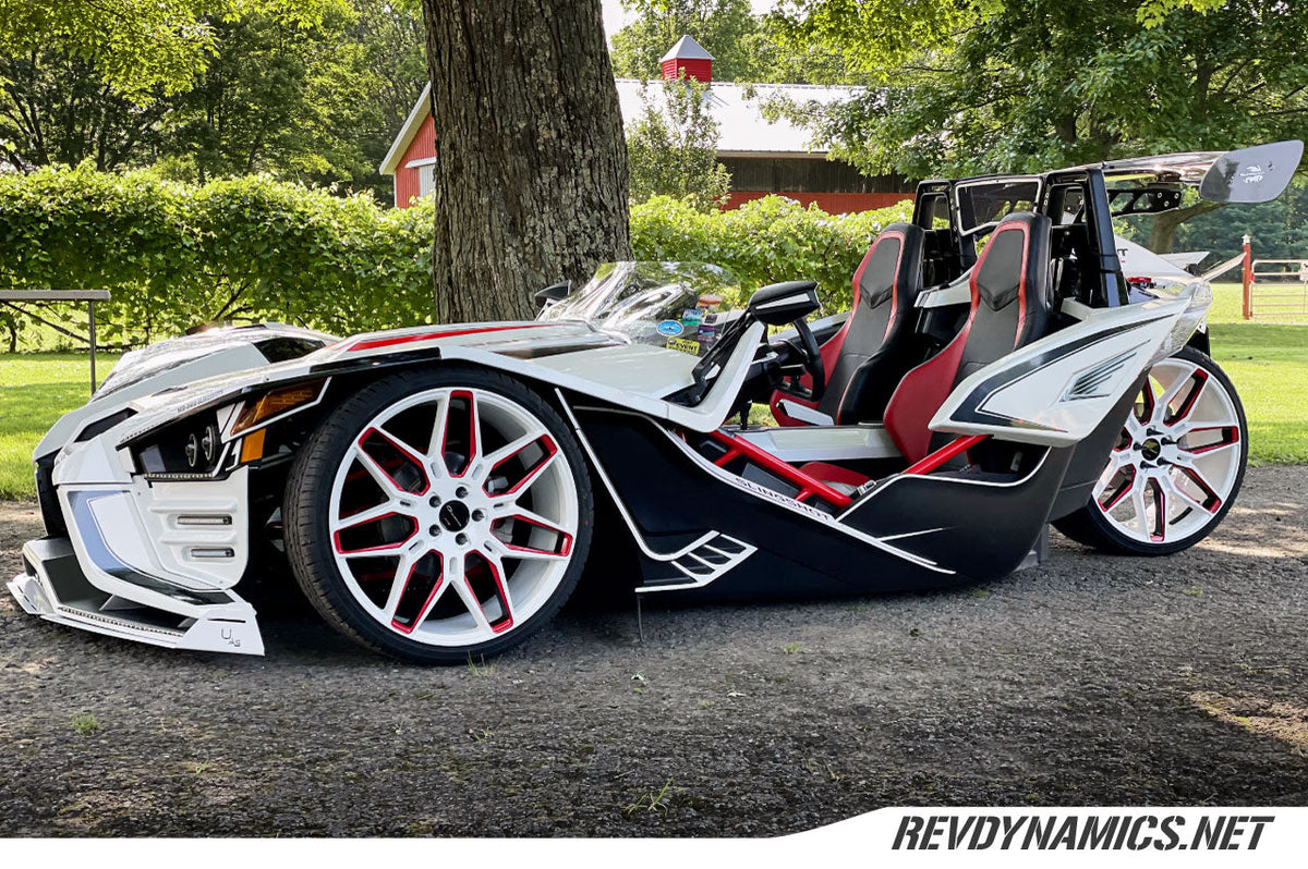 Polaris Slingshot Pearl White and Indy Red Two Tone Rims on air ride suspension